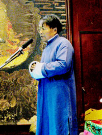 Naxi Orchestra conductor Xuan Ke addresses the audience in the city of Lijiang, China.